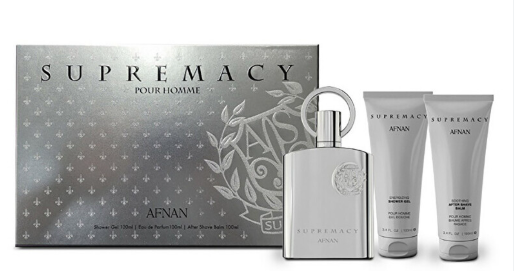 A fragrance gift set for men by AFNAN, featuring a silver 'Supremacy Pour Homme' bottle alongside its textured silver packaging box and two matching toiletry tubes.