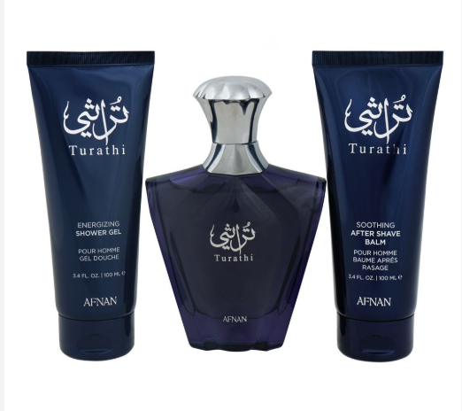 A three-piece Afnan Turathi men's grooming set featuring a dark blue shower gel tube, a matching bottle of fragrance with a silver cap, and a soothing after shave balm tube, all on a white background.