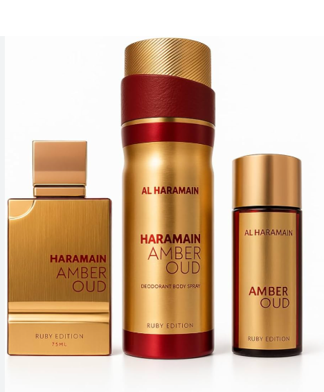 Al Haramain Amber Oud Ruby Edition fragrance set featuring a rectangular 75ml perfume bottle, a 300ml deodorant body spray canister, and a smaller 15ml body spray bottle, all in a luxurious gold and ruby red color scheme.