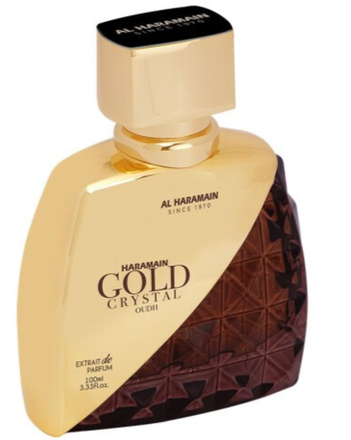 Al Haramain Gold Crystal Oudh perfume bottle, 120ml, featuring a metallic gold body with a dark brown faceted crystal pattern on the lower right and a black cap.
