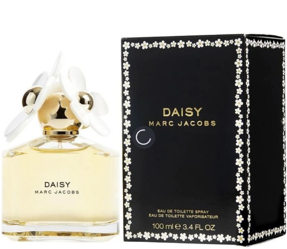 Marc Jacobs Daisy Eau de Toilette perfume bottle with a white flower cap next to its black packaging box decorated with white flowers.