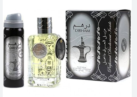 A perfume gift set featuring a black spray bottle, a clear glass bottle filled with pale yellow liquid, and a black-and-silver decorative box labeled DIRHAM.