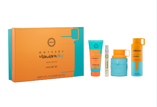 Odyssey Mandarin Lily grooming gift set featuring a teal and orange box alongside four matching grooming items: a tube, a small spray bottle, a jar, and a bottle, all on a plain white background.
