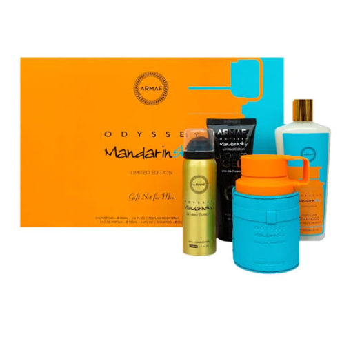 Armaf Odyssey Mandarin Gift Set for Men, featuring a bright orange and blue gift box with five matching fragrance and body care products in the foreground, including a gold bottle, a black tube, and a bright blue container with an orange cap.