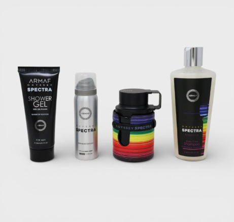 Four Armaf Odyssey Spectra products arranged on a light gray background: a black shower gel tube, a silver deodorant can, a black tumbler with a rainbow wrap, and a cream shampoo bottle with a black label.