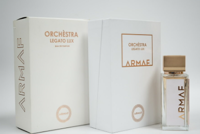 Armae Orchestra Legato Lux Eau de Parfum shown with its white outer packaging box, inner box, and a clear glass bottle with a gold cap on a light gray background.