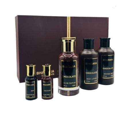 Bharamati Chocolate gift set featuring a dark brown box with a gold vertical stripe, four dark brown bottles with black caps and gold labels, including body lotion, shower gel, and two smaller bottles, on a white background.