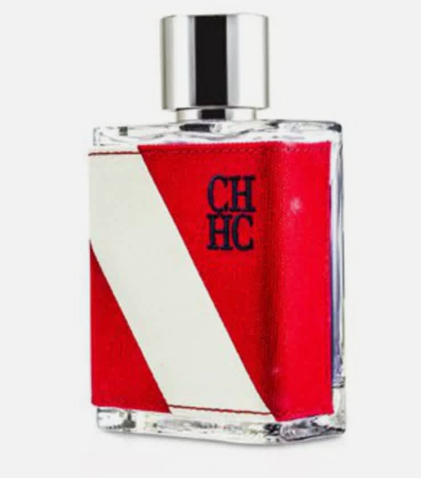 A rectangular glass perfume bottle with a silver cap, featuring a red and white geometric pattern on the front with the letters 'CH HC' printed in navy blue.