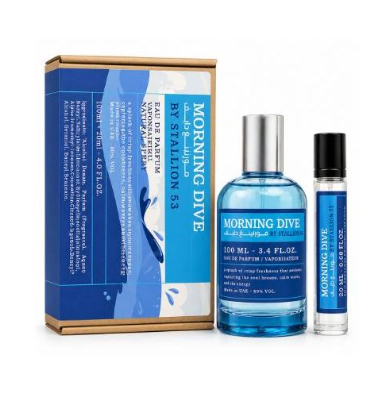 A perfume gift set featuring a blue and white box, a 100 ml blue glass bottle with a silver cap, and a smaller 10 ml travel atomizer, all labeled 'MORNING DIVE BY STATION 53'.