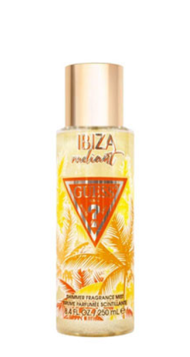 Guess Itza Radiant Shimmer Fragrance Mist in a 250 mL clear bottle with a metallic gold cap, featuring a yellow and orange tropical design with palm leaves.