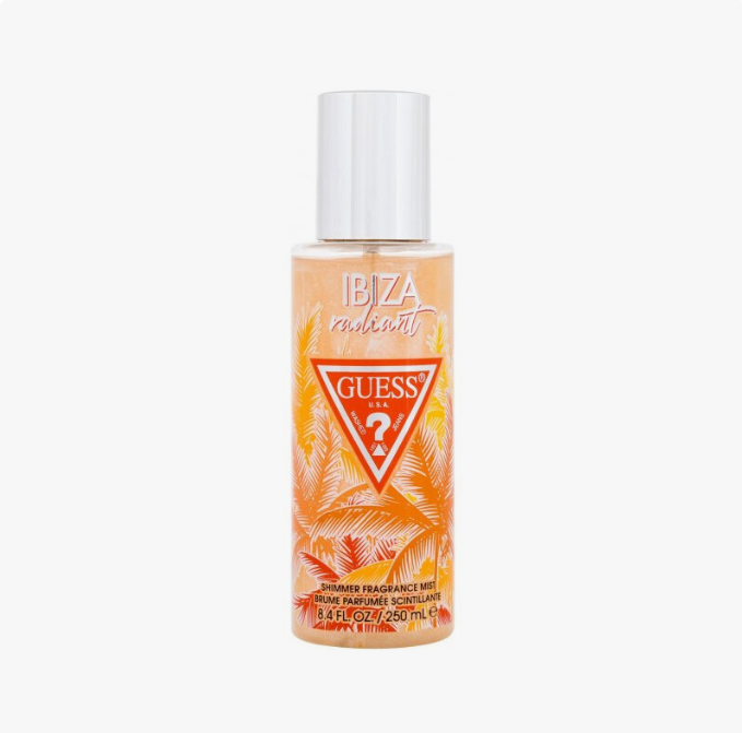 Guess by Guess Ibiza Ambre shower fragrance mist in a clear bottle with a white cap, featuring orange and yellow tropical palm leaf graphics on a white background.