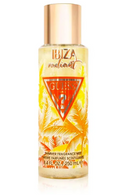 Guess 22 Ibiza Radiant Shimmer Fragrance Mist in a clear cylindrical bottle with a metallic rose gold cap, featuring a yellow and orange tropical palm tree design with a red Guess 22 logo.