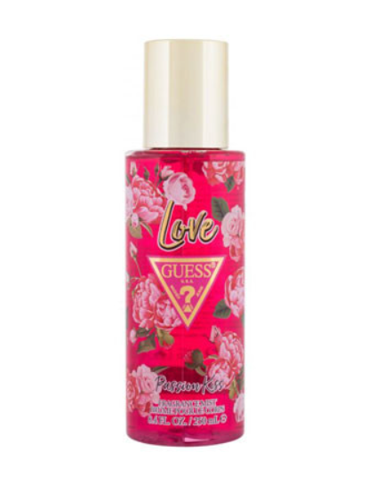 A bottle of GUESS Love Passion Kiss body spray, featuring a vibrant pink floral label with rose illustrations and a metallic gold cap, set against a plain white background.