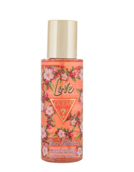 Guess Love Sheer Attraction body spray in a clear bottle with a gold cap, featuring a pink and orange floral label.