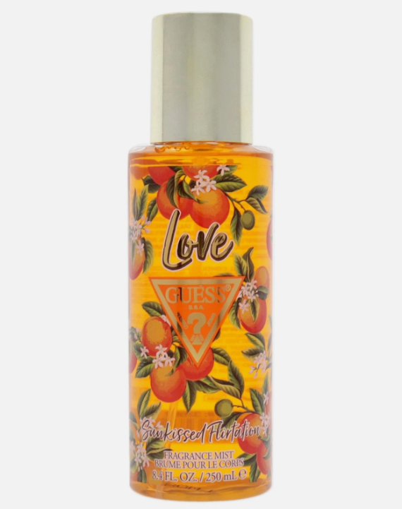 Guess Sunkissed Flirtation perfume spray bottle with a gold cap, featuring a vibrant orange and yellow label with illustrations of oranges and the word 'Love'.