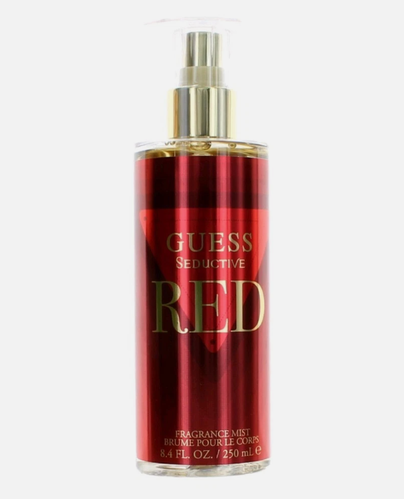 Guess Seductive Red fragrance mist in a red spray bottle with a gold pump and gold lettering, on a light gray background.