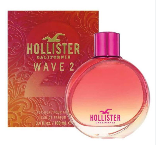 Hollister California Wave 2 Eau de Parfum bottle in front of its red and orange patterned retail box. The bottle is round with a pink-to-clear gradient and a metallic pink cap, featuring the Hollister logo.