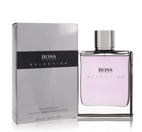 BOSS Selection Eau de Toilette perfume bottle and its packaging box, featuring a light purple liquid in a clear glass bottle with a silver cap, next to its silver and black box.