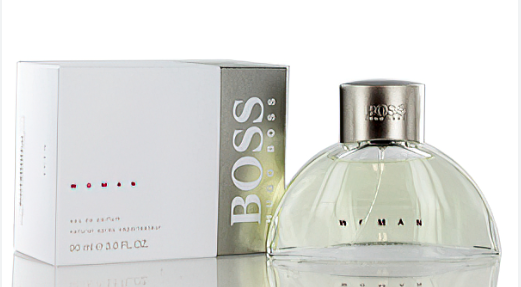 Hugo Boss Woman perfume bottle with a clear glass body and silver cap, shown next to its white and silver packaging box on a white background.