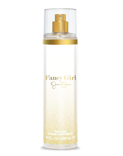 Fancy Girl body spray by Jessica Simpsons in a clear cylindrical bottle with a gold spray top and gold lettering, set against a plain white background.
