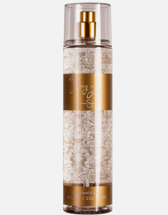 A clear cylindrical spray bottle of Macy's Signature fragrance with a gold pump, clear cap, and ornate gold-and-white patterned label on a light gray background.