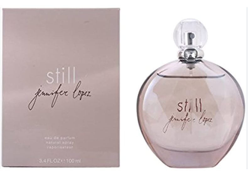 Jennifer Lopez Still Eau de Parfum bottle and its matching pink packaging box, shown side-by-side on a white background.