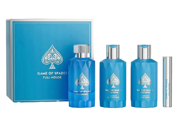 A Game of Spades Full House fragrance gift set on a white background, featuring a blue presentation box, three blue bottles with silver caps, and a slim silver tube.
