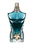 A sculptural torso-shaped perfume bottle filled with blue-green liquid, featuring a gold-tone cap and a gold emblem at the waist, shown on a plain white background.