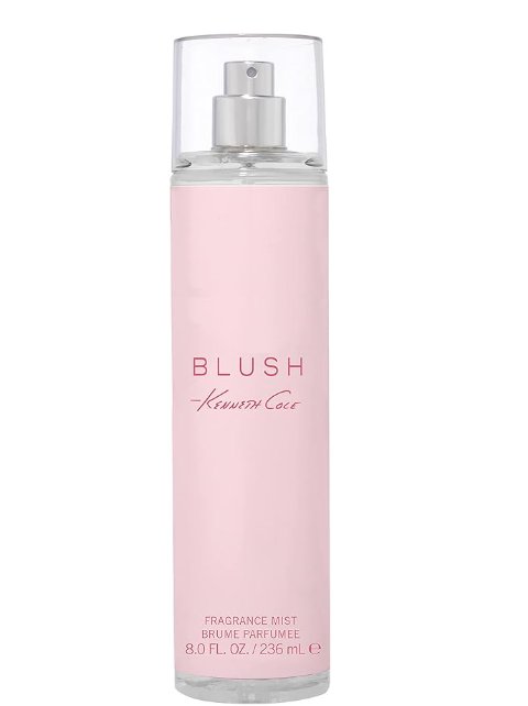 A bottle of Kenneth Cole Blush Fragrance Mist, featuring a light pink cylindrical bottle with a clear cap and silver spray nozzle, set against a plain white background.