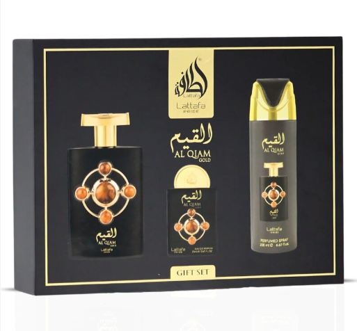 Laitafa Al Qum Gold gift set containing a perfume bottle, a smaller bottle, and a reed diffuser spray, all in black with gold and orange accents, presented in a black and gold box.