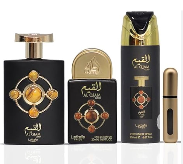A fragrance gift set from Laalata for Al Qham Gold, featuring a large black bottle with gold detailing, a smaller matching perfume bottle, a tall black and gold perfume spray bottle, and a small gold travel atomizer, all on a white background.