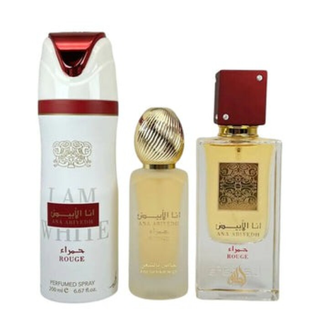 A three-piece fragrance set from Anaa Al-Riyan featuring a white and red deodorant spray, a small clear bottle with a gold cap containing pale yellow liquid, and a rectangular clear perfume bottle with a red cap and gold patterned label.