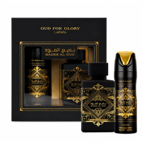Lattafa Oud For Glory fragrance gift set featuring a black box with a clear window behind two bottles and one spray bottle in front, all decorated with ornate gold geometric patterns and Arabic text.