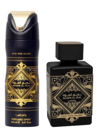 Lattaafa Badee Al Oud perfume set featuring a matte black aerosol can with gold geometric patterns and a matching rectangular matte black bottle with a black cap, both labeled 'Oud For Glory'.