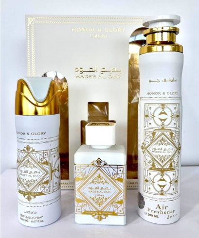 A luxury fragrance gift set from Honor & Glory Arabia, featuring a white and gold Air Freshener bottle, a limited edition spray bottle, a perfume bottle, and the branded gift box.