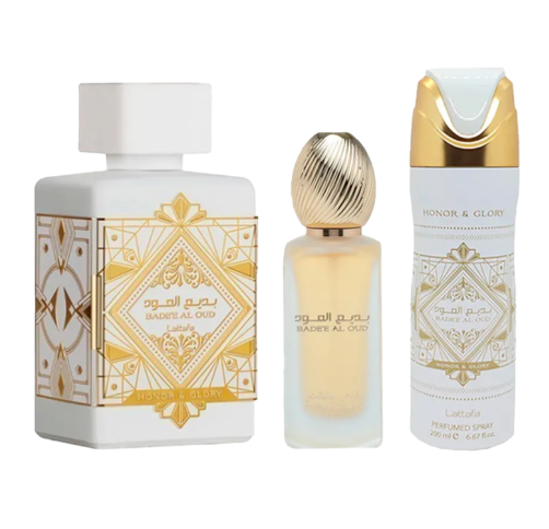 Three luxury fragrance products from Bader Al-Oud are displayed side by side on a clean white background: a large white rectangular perfume bottle with ornate gold geometric artwork, a smaller clear glass bottle with pale yellow liquid and a gold textured cap, and a white cylindrical deodorant-style perfume spray canister with gold detailing and the text 'HONOR & GLORY'.