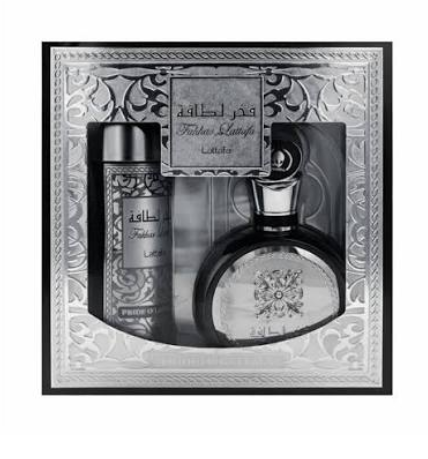 A men's fragrance gift set in an ornate silver-toned presentation box, featuring a large oval perfume bottle, a cylindrical deodorant or body spray bottle, and a small card with Arabic text.