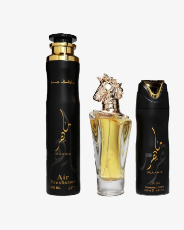 Three perfume-related items on a plain white background: a tall matte black Air Freshener bottle with gold lettering and cap, a clear rectangular perfume bottle filled with golden liquid and topped with a horse-shaped cap, and a smaller black perfume spray bottle with gold detailing.