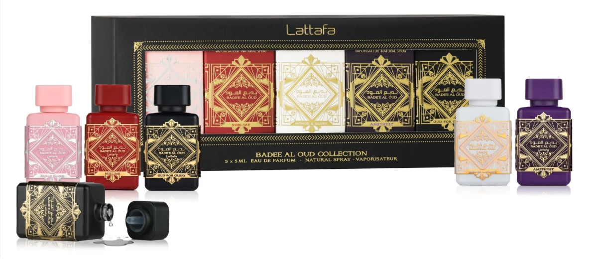 Lattaafa Barbe Al Old Collection gift set featuring six miniature perfume bottles in pink, red, black, white, beige, and purple with ornate gold labels, displayed in front of their black and gold presentation box.
