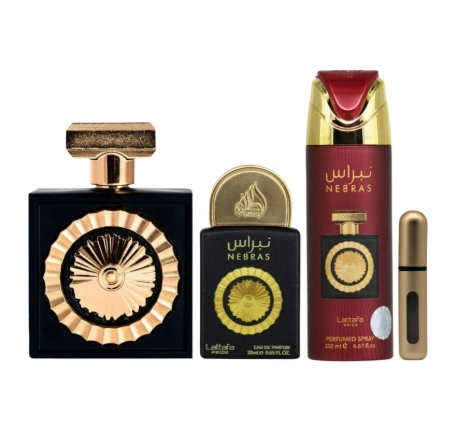 A fragrance gift set featuring a large black perfume bottle with a gold sunburst emblem, a smaller black perfume bottle with a gold cap, a tall red aerosol deodorant/spray can with gold and red detailing, and a small gold travel spray vial, all on a white background.
