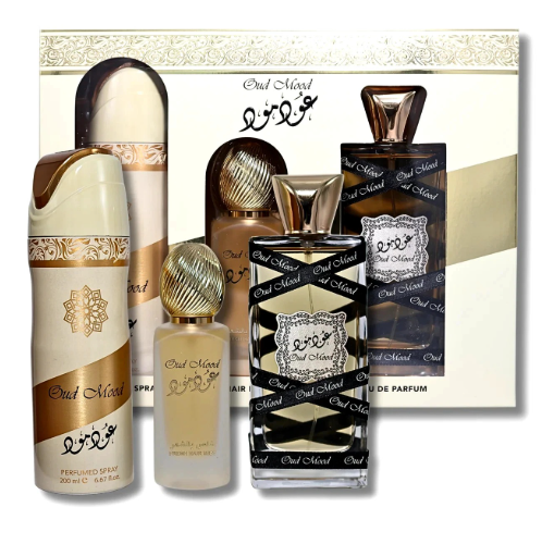 A perfume gift set featuring multiple bottles and a matching box from the brand 'Oud Mowal', including a large dark brown bottle, a cream spray bottle, a small cream bottle, and a tall dark brown box with gold patterns.
