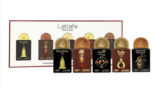 A Lattafa Pride gift set containing eight different Arabic perfume bottles with gold and brown caps, displayed in front of their white and red packaging box.