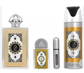 A perfume gift set featuring a large rectangular bottle with a silver crown cap, a small rectangular bottle, a silver atomizer spray, and a tall silver-and-gold perfume spray can, all with ornate black and white labels on a white background.