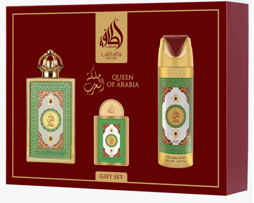 Lattafa Queen of Arabia gift set containing a perfume bottle, a smaller matching bottle, and a cylindrical deodorant or body spray can, all decorated with green and gold patterns on a deep red gift box.