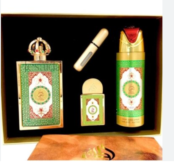 A boxed fragrance gift set with multiple decorative bottles and a small cylindrical item arranged inside a black presentation box. The set includes a large rectangular bottle with a crown cap, a tall cylindrical bottle with a red and gold top, a small rectangular box, and a slim cylindrical piece, all decorated with green, gold, and white ornamental patterns.