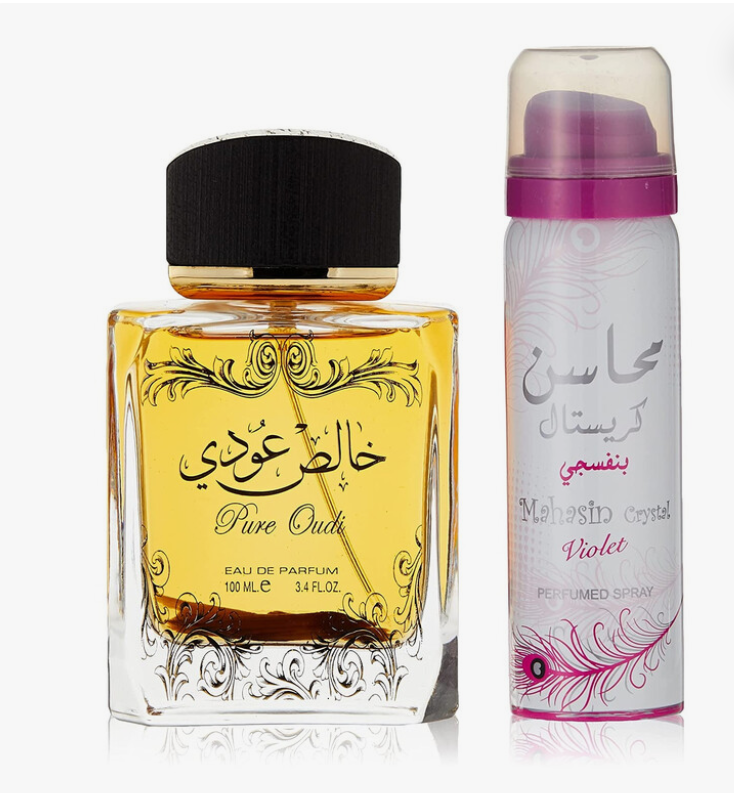 A 100 mL bottle of Pure Oudh Eau de Parfum with golden-yellow liquid and a black cap, shown next to a white aerosol perfume spray can labeled 'Maheshu Crystal Violet' with pink accents, on a white background.