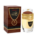 Arabia Le Chameau Eau de Parfum shown with its dark brown wooden box and the clear glass bottle containing a pale golden liquid, both featuring black and gold labels.