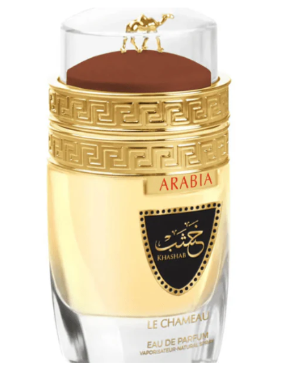 Arabia Khashash Le Chameau Eau de Parfum bottle with a gold and black label, clear glass body, and a brown cap with a gold camel emblem, on a white background.