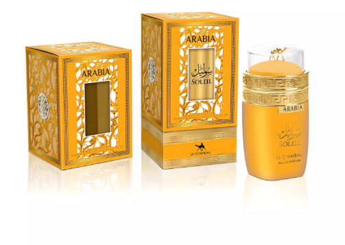 Le Chameau Arabia Soleil facial cream and its packaging, featuring a golden-yellow jar with a clear cap and ornate gold and yellow boxes on a white reflective background.