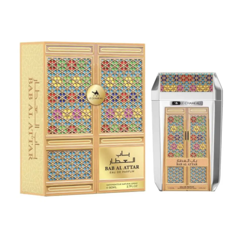 A perfume product shown with its outer box and matching bottle on a plain white background. The packaging features an ornate multicolor geometric pattern resembling traditional window lattices on a gold-toned base, with the text 'BAB AL ATTAR' and 'EAU DE PARFUM' visible.